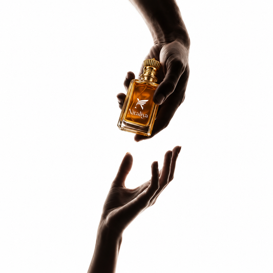 Nitaliya luxury perfume bottle held between hands with premium fragrance presentation